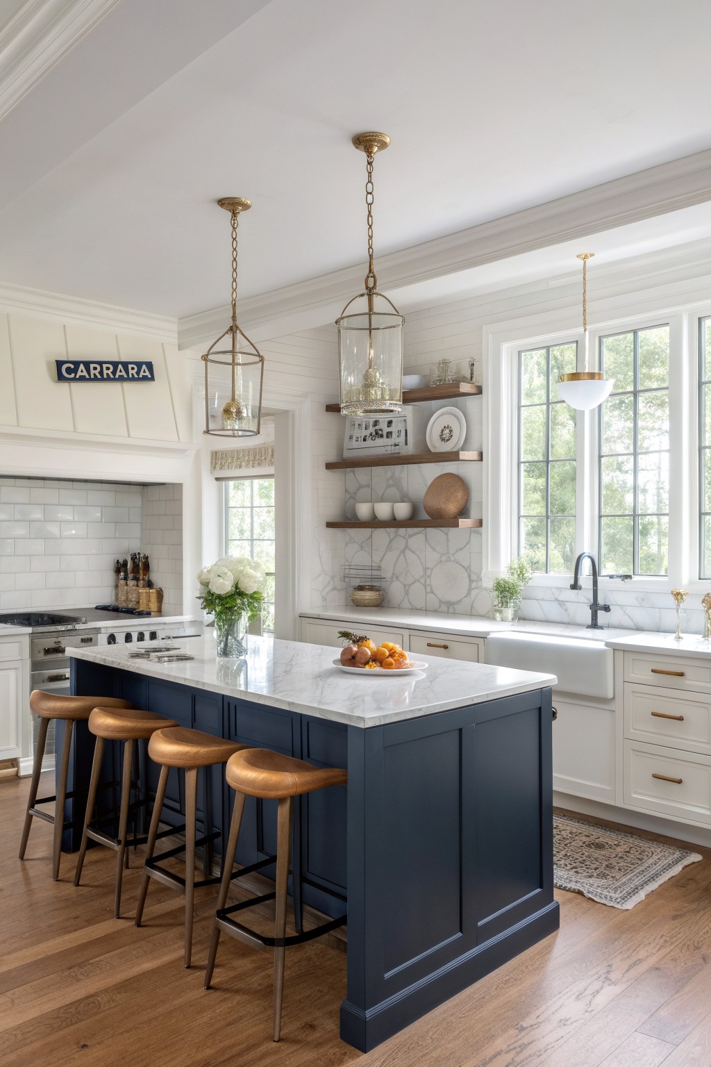 Kitchen featuring a navy blue center island with leather stools, white cabinets, marble counters, and wood floors under pendant lights