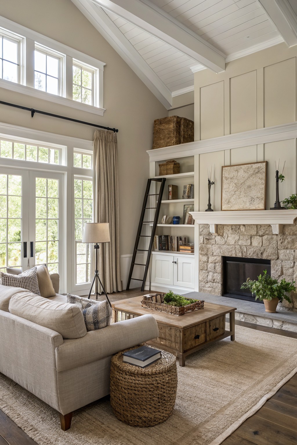 Living room with warm greige walls beside a stone fireplace.