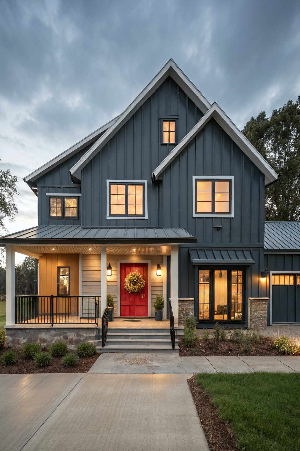A house exterior painted in deep blue gray siding with white trim.