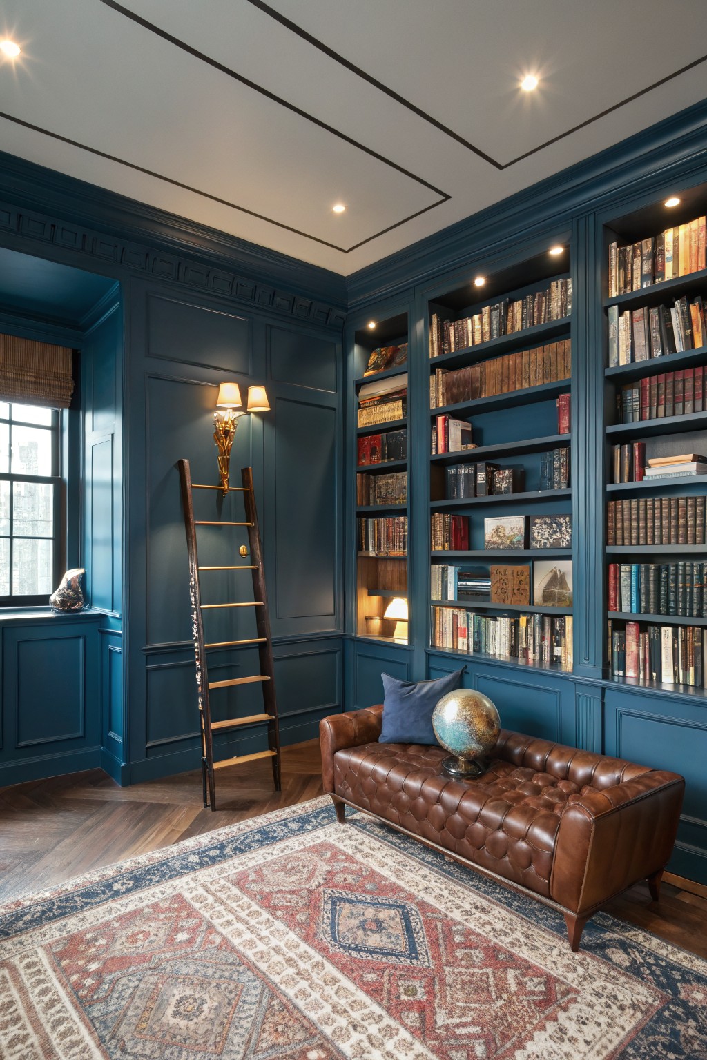 A home library with deep navy blue walls and built-in bookshelves.