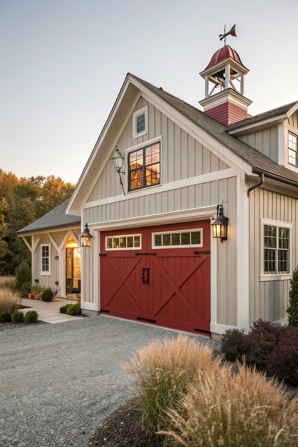A house with light greige siding, white trim, and red garage doors.