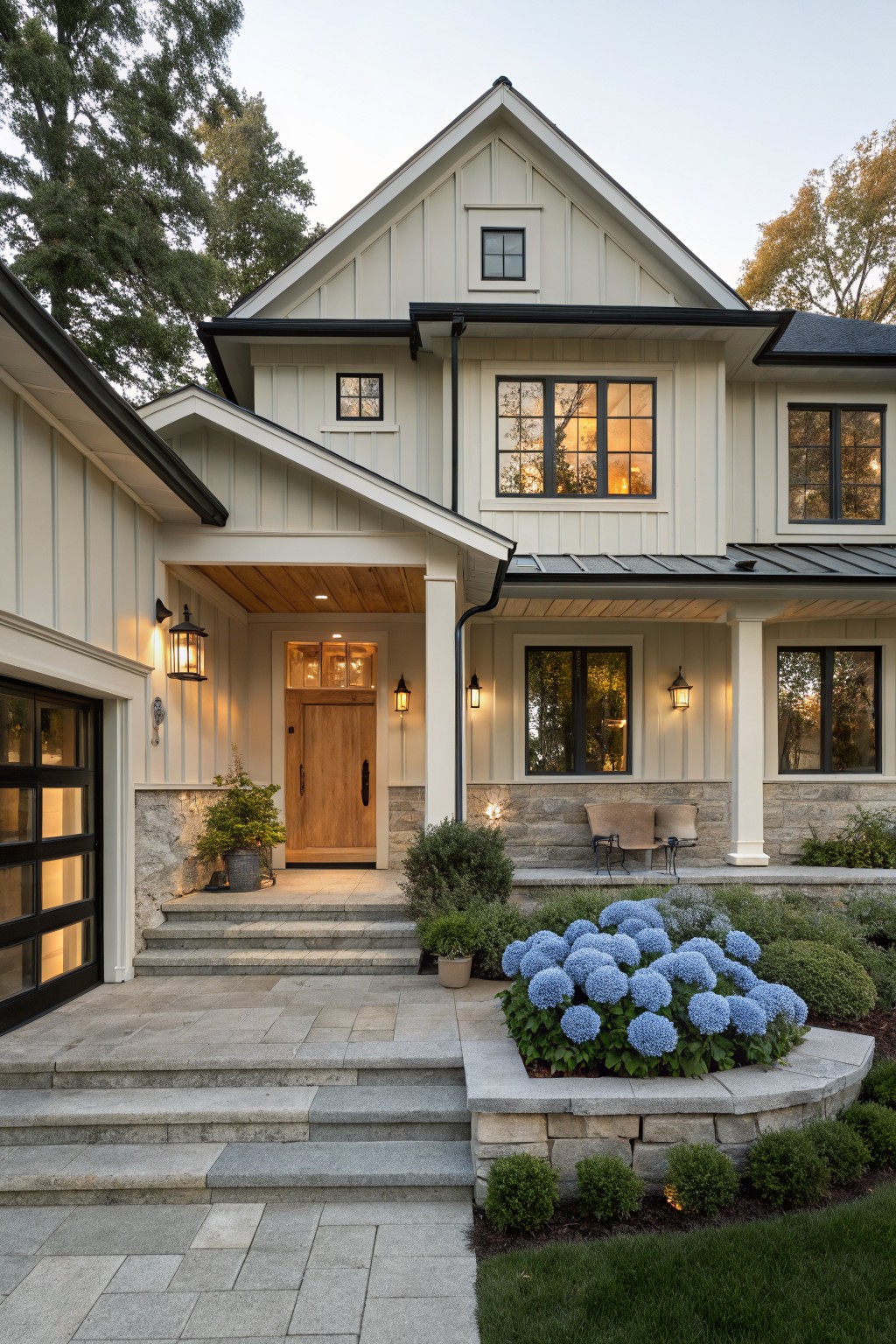 Two-story house with warm off-white siding and black window trim.