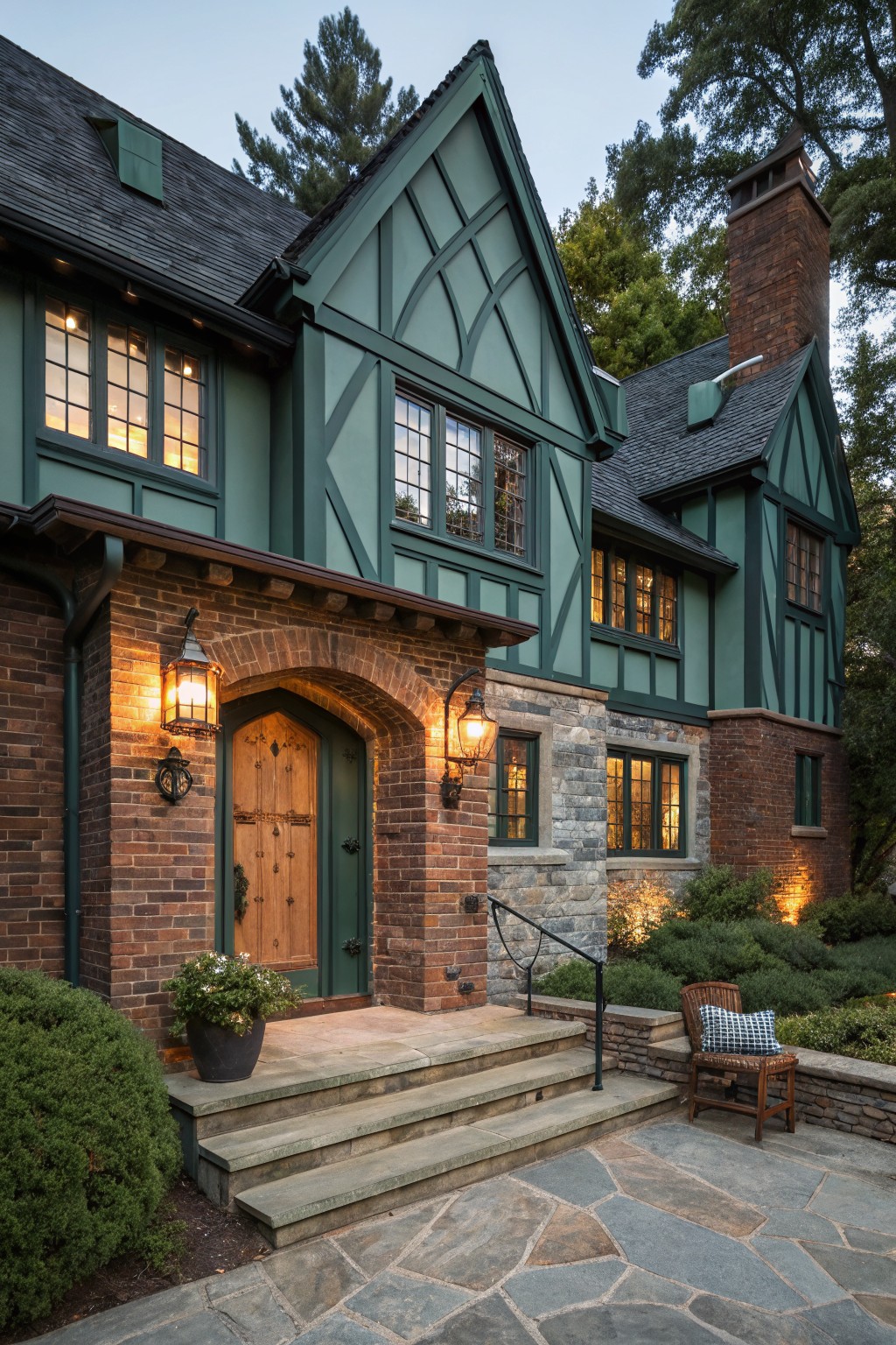 A brick house with muted green siding and exposed timber framing.