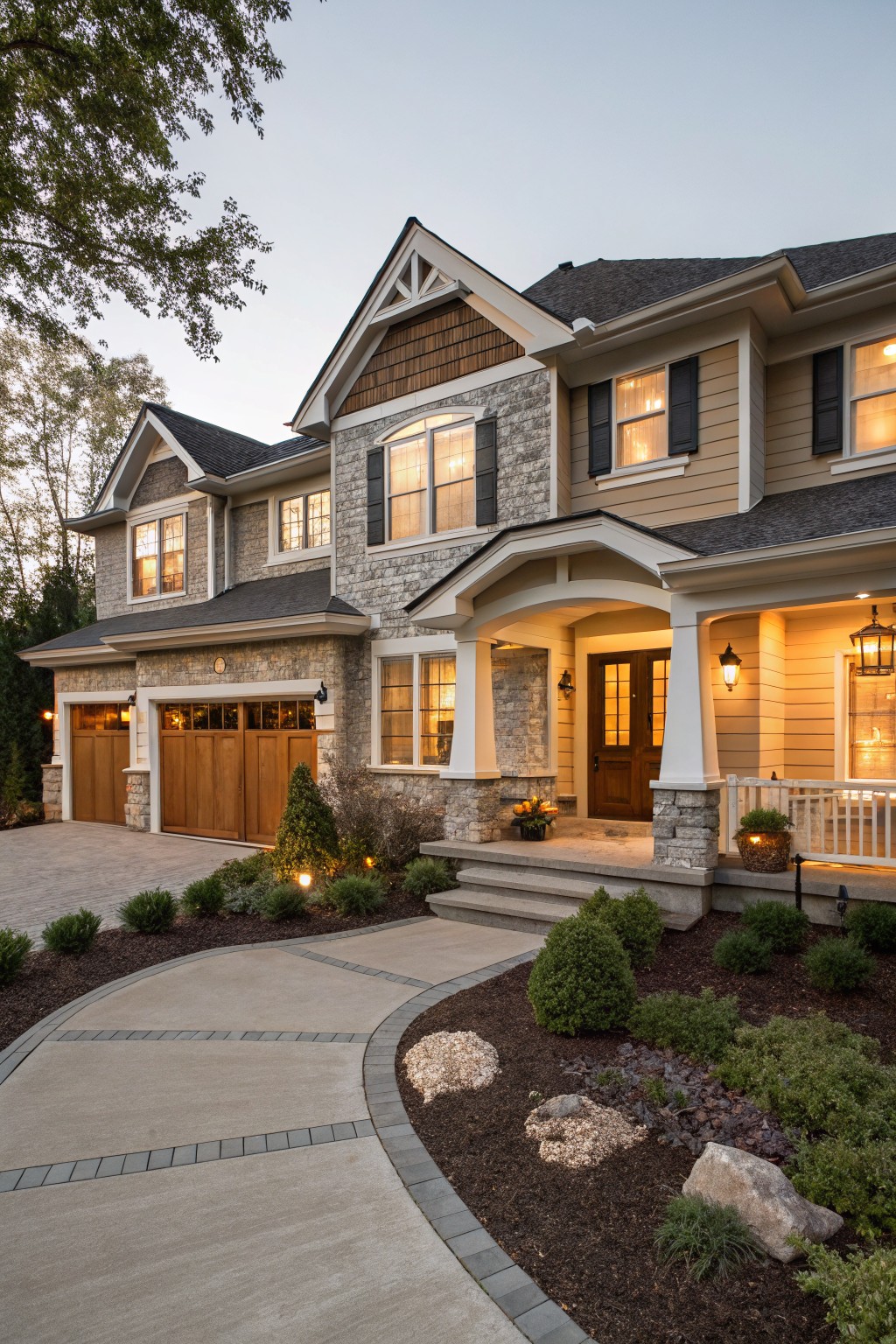 Light greige siding covers the exterior of a two-story house with stone accents and a front porch.