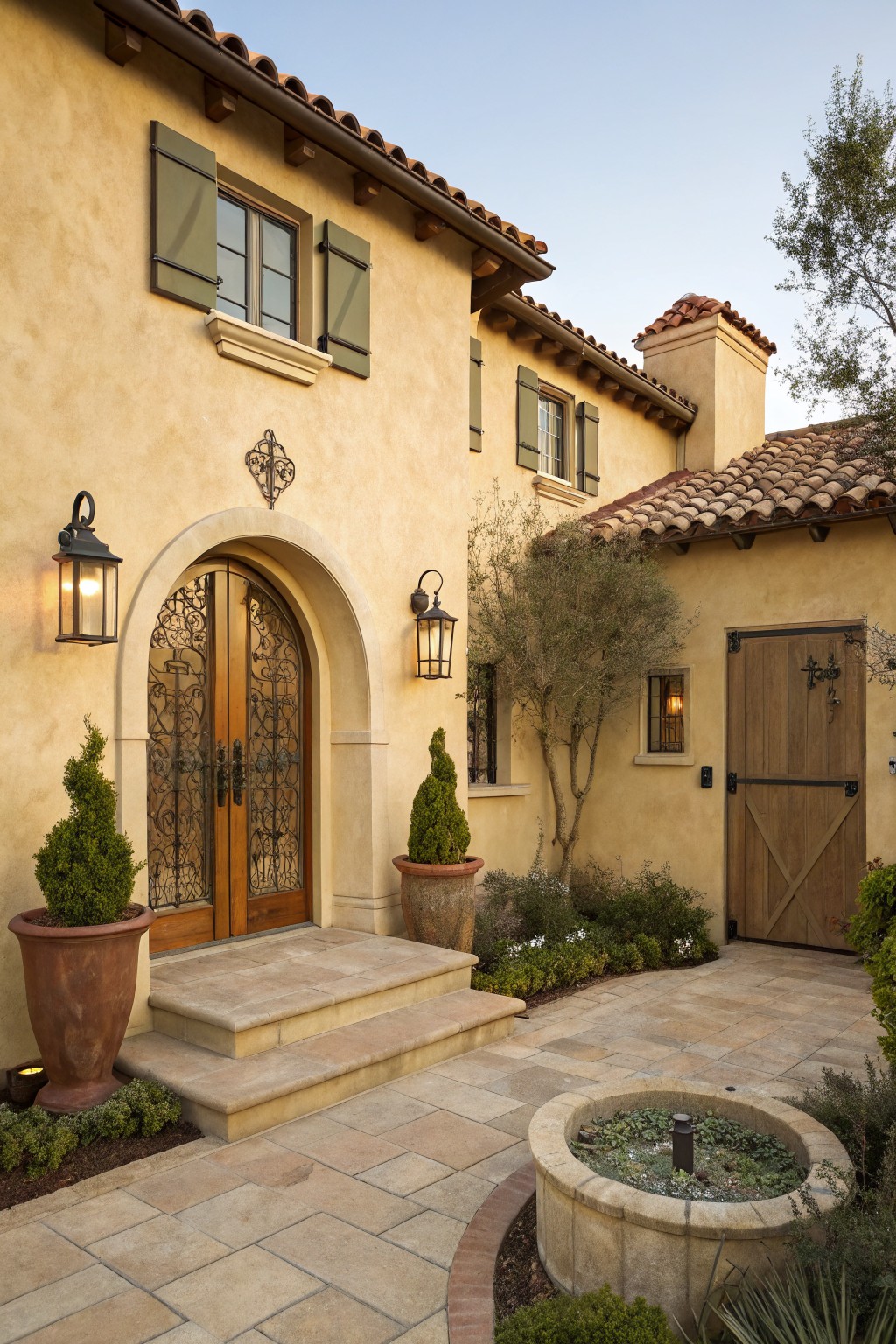 Warm beige stucco covers the exterior walls of a Mediterranean-style house.