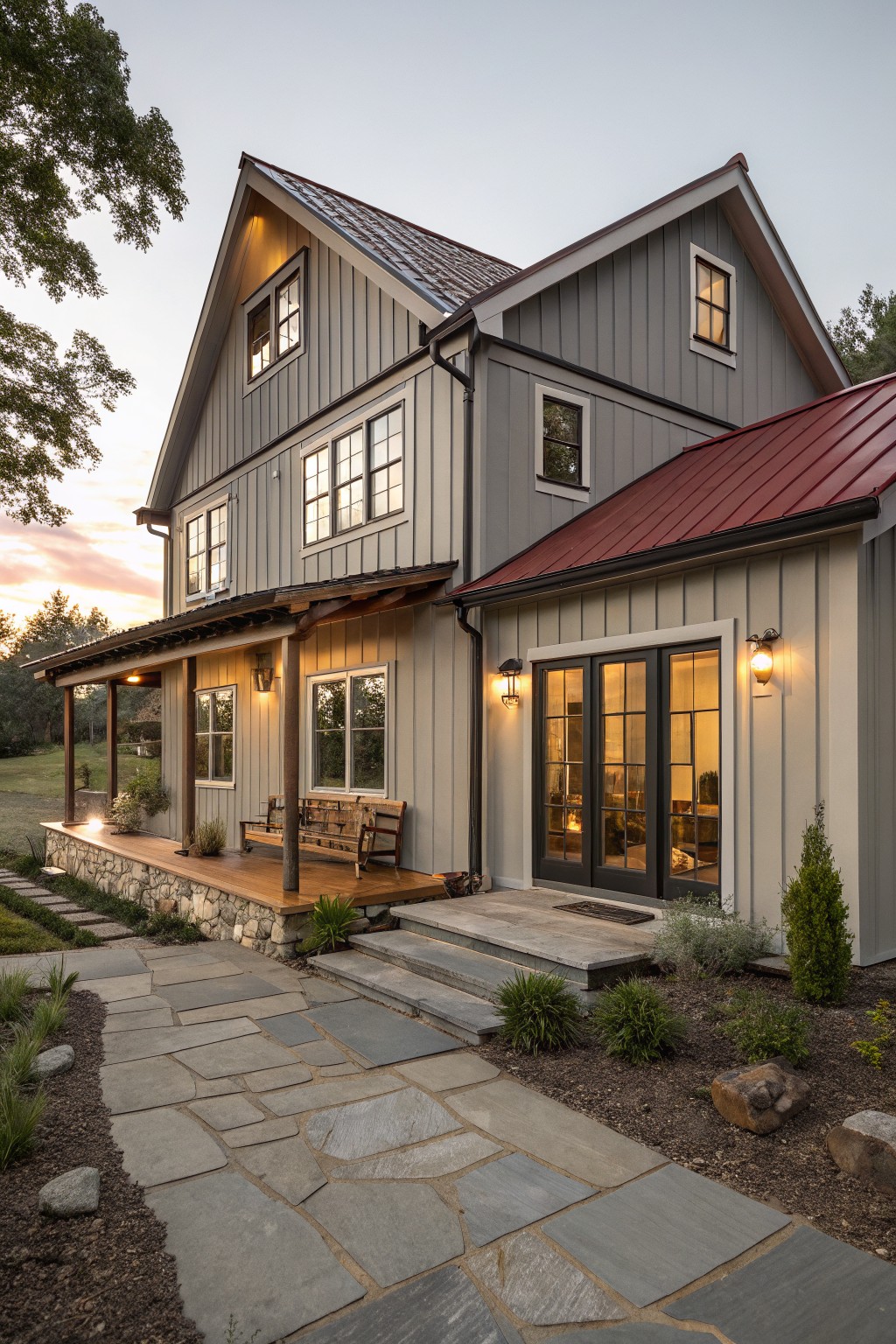 A two-story house with muted gray siding and a red metal roof.