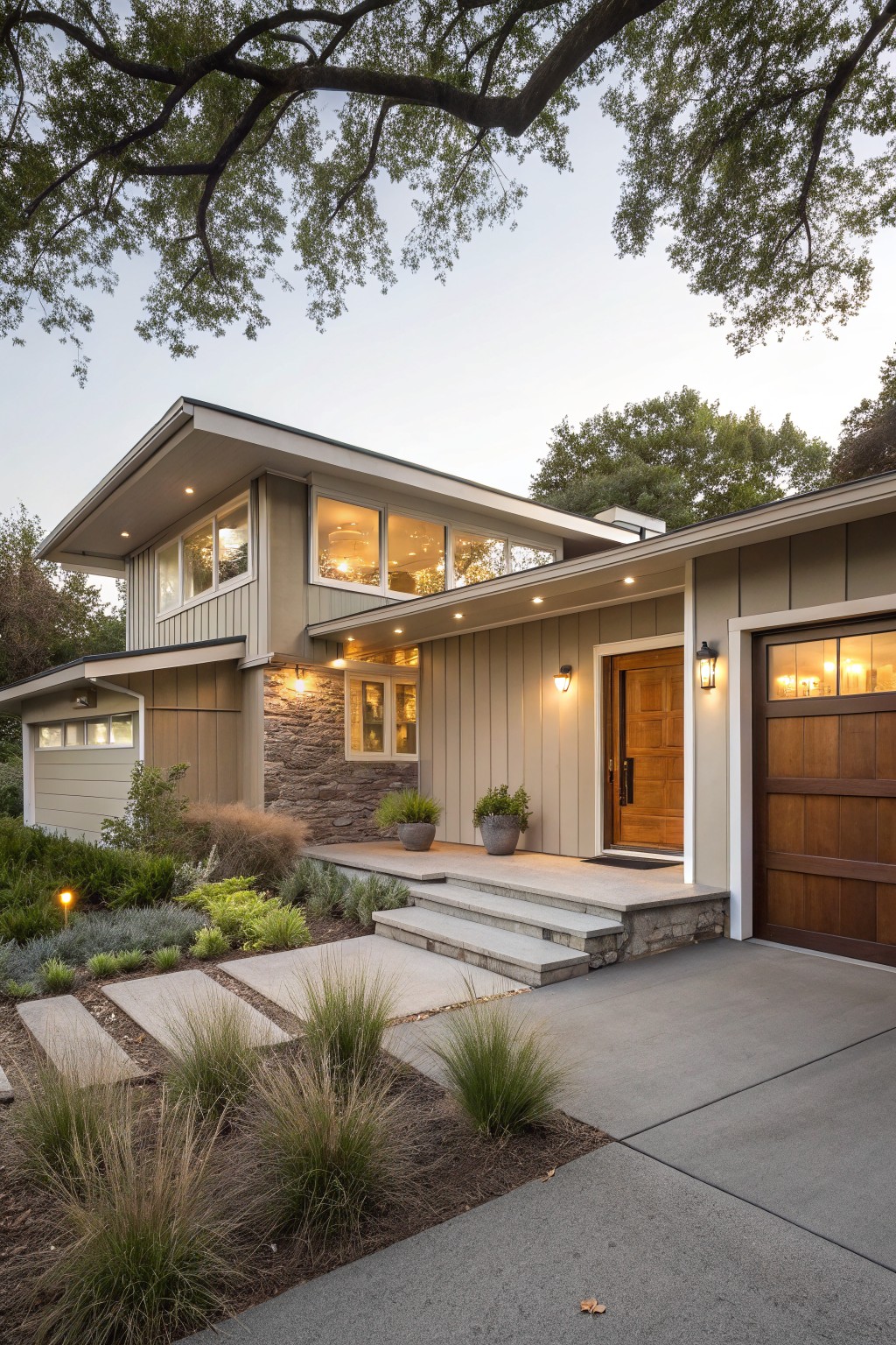 A modern house exterior with soft greige siding and white trim.