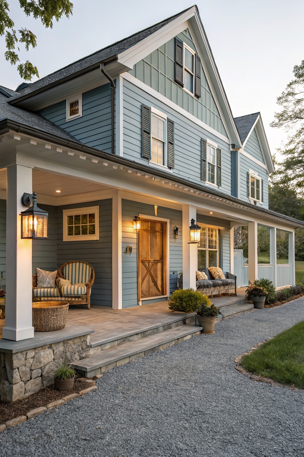 Light blue gray siding covers the exterior of a two-story house with a front porch.