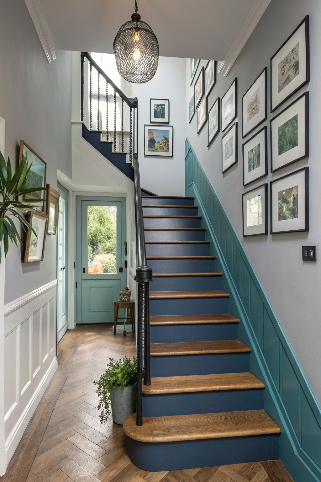 Teal Paneling Along The Stairs