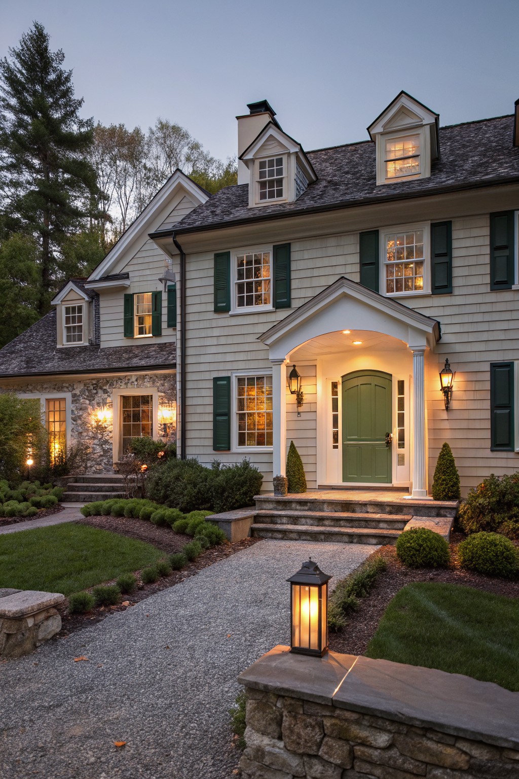 A house exterior with light greige siding and a brown roof.