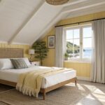 Pale yellow walls in a bedroom with slanted ceilings and white trim.