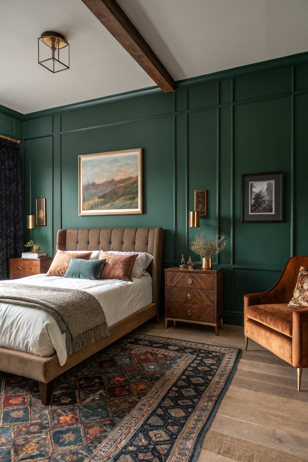 A bedroom with deep green paneled walls and wood furniture.