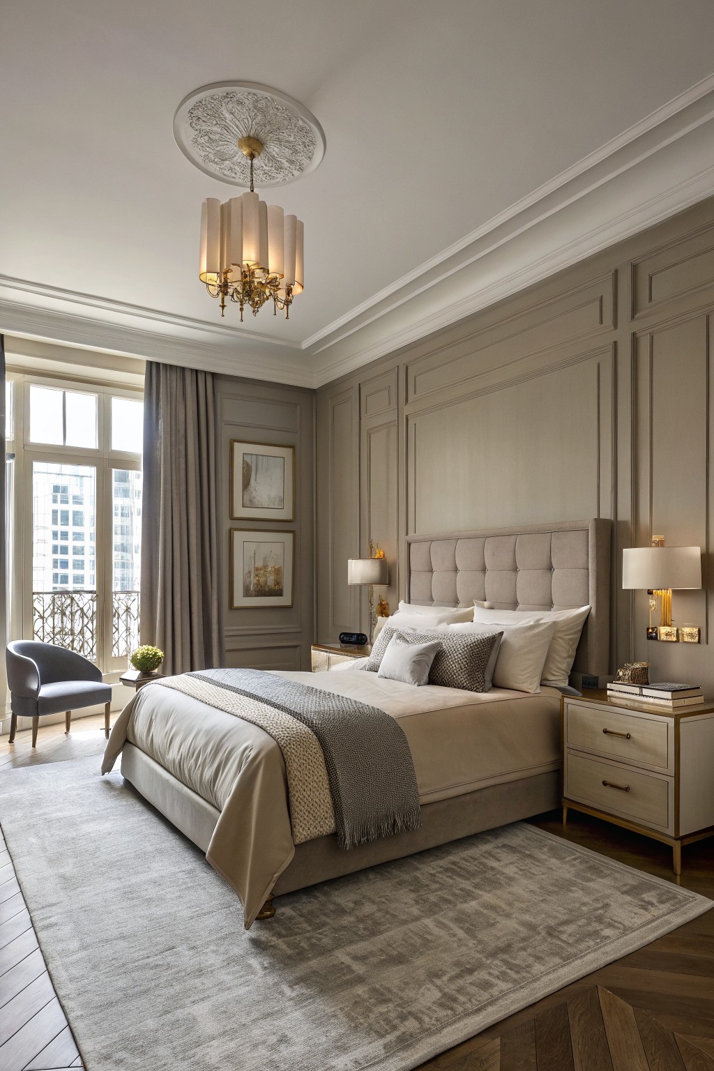 Bedroom walls painted a soft greige with raised panel molding.