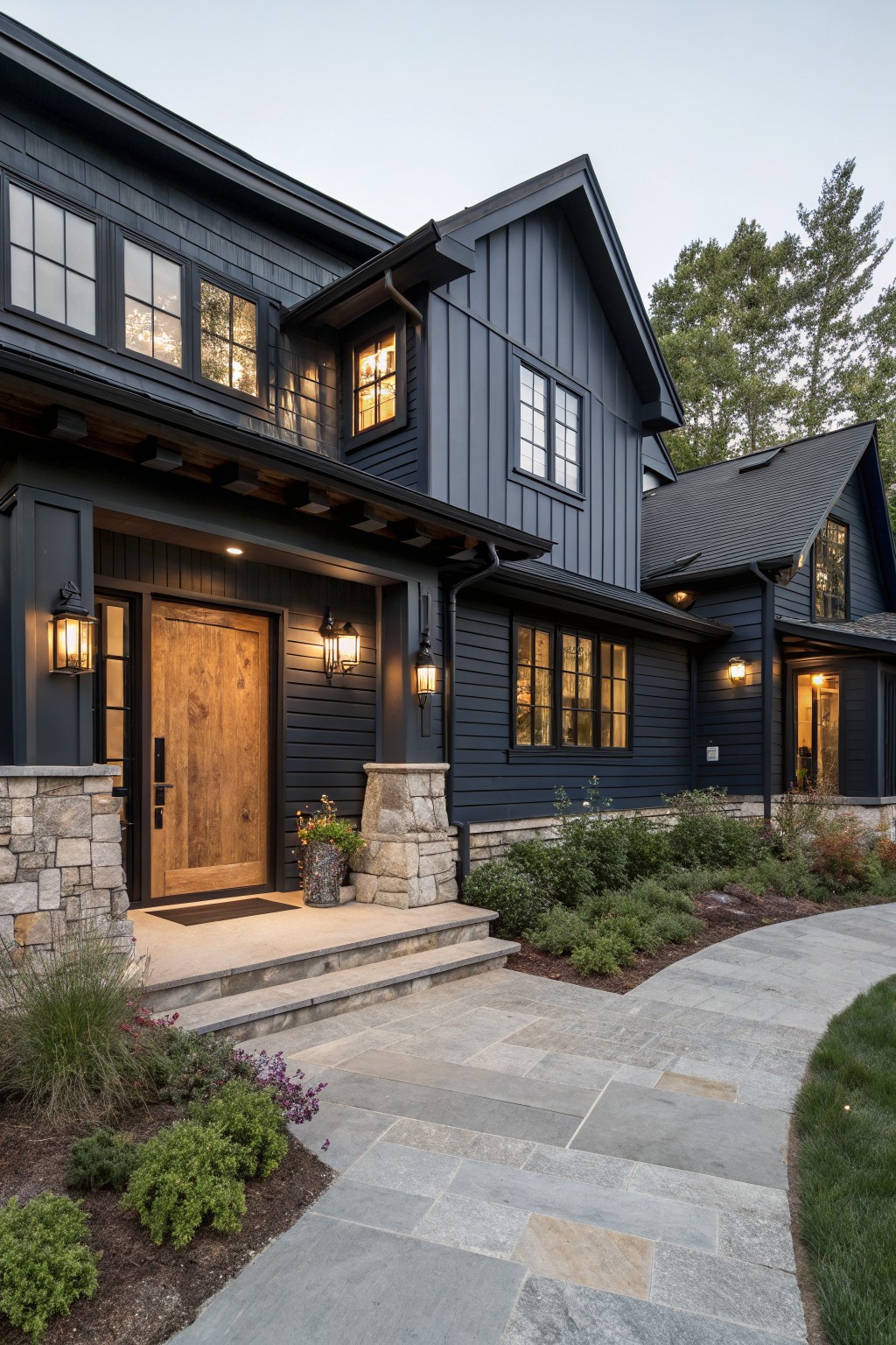 A modern farmhouse with deep navy siding and black trim.