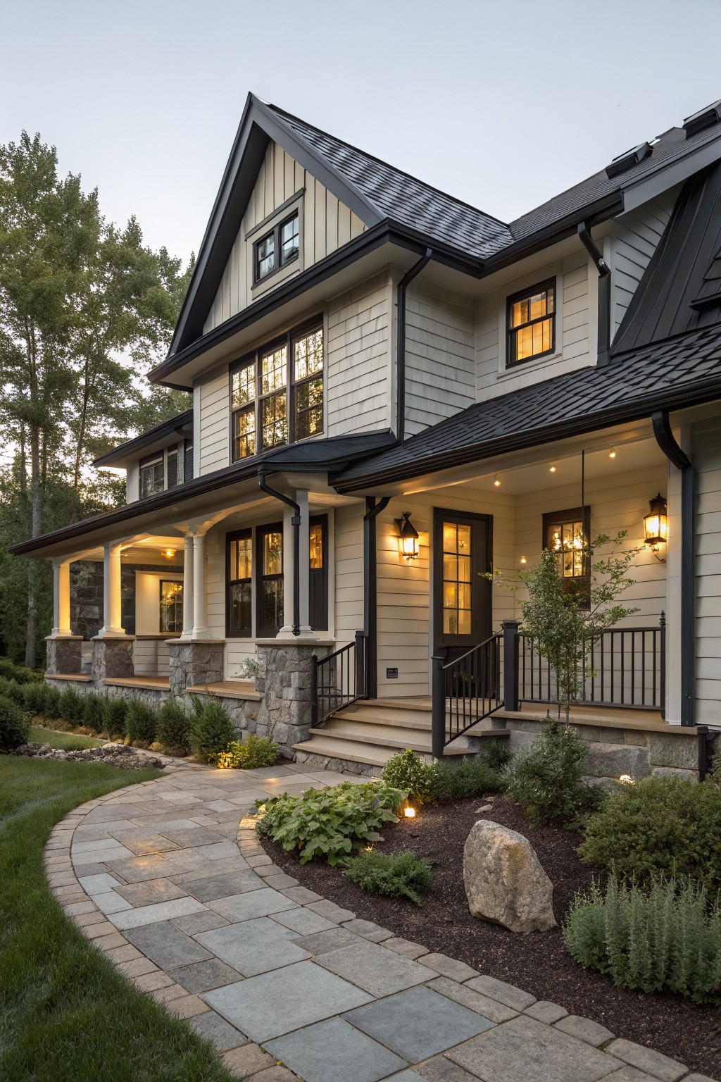Black trim and railings on a light-sided farmhouse exterior.