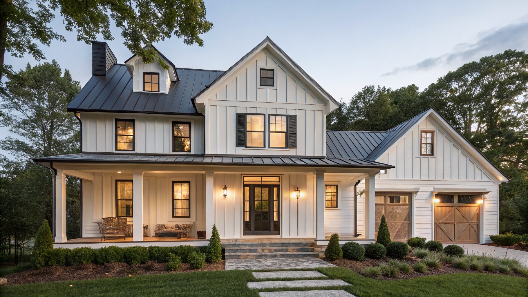 White farmhouse exterior with crisp siding and black trim details.