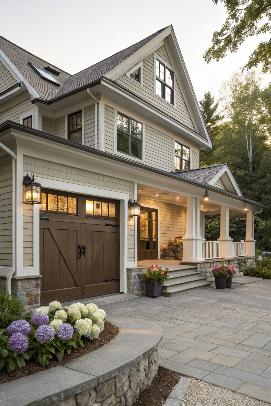 Light greige siding on a farmhouse exterior with white trim and stone foundation.