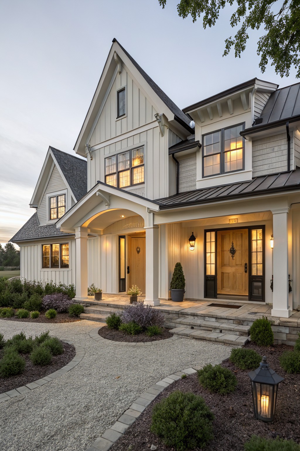 Farmhouse exterior with light greige siding and dark trim.
