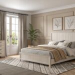 A bedroom with soft greige walls and light wood flooring.