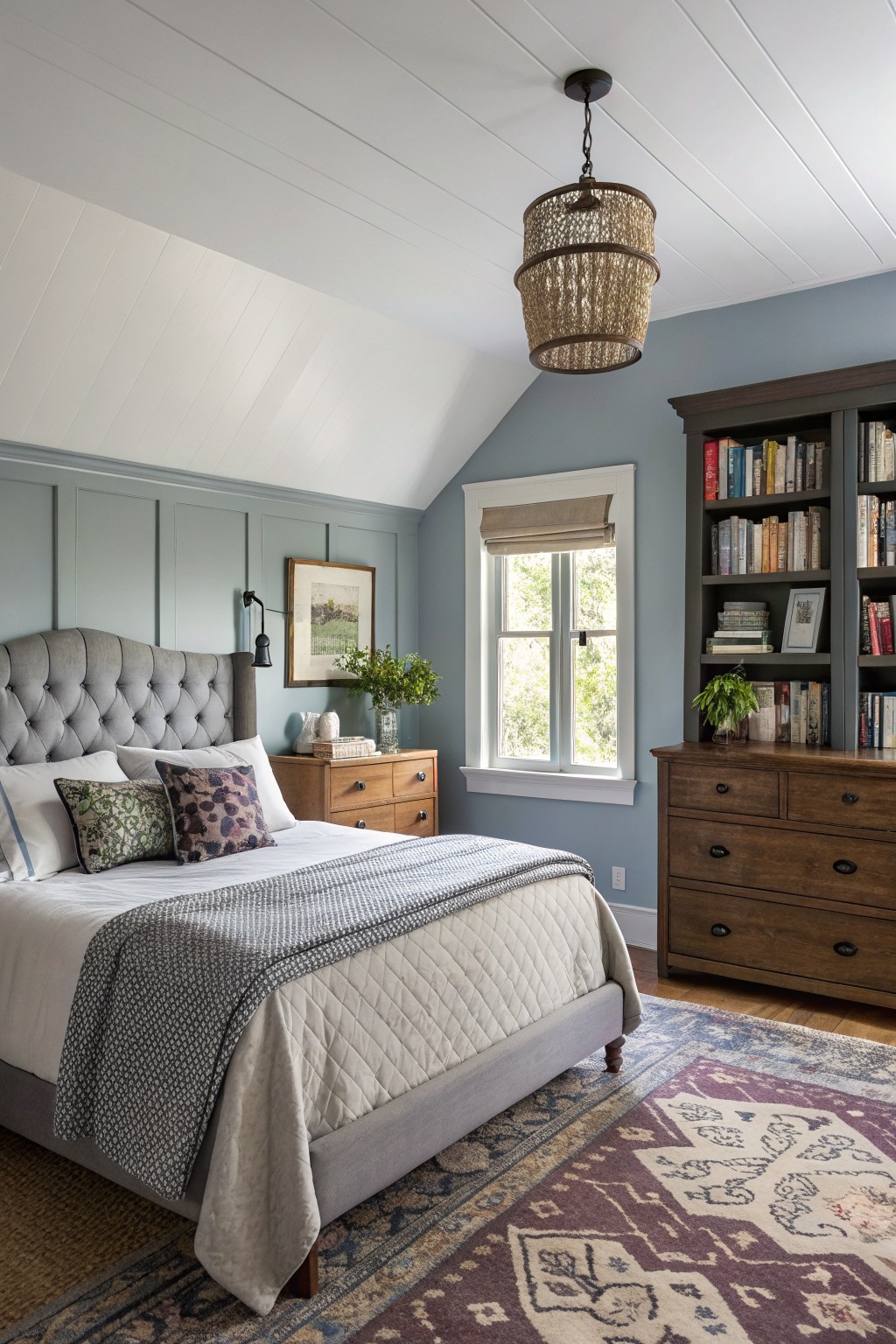 Bedroom walls painted in a soft blue gray color.