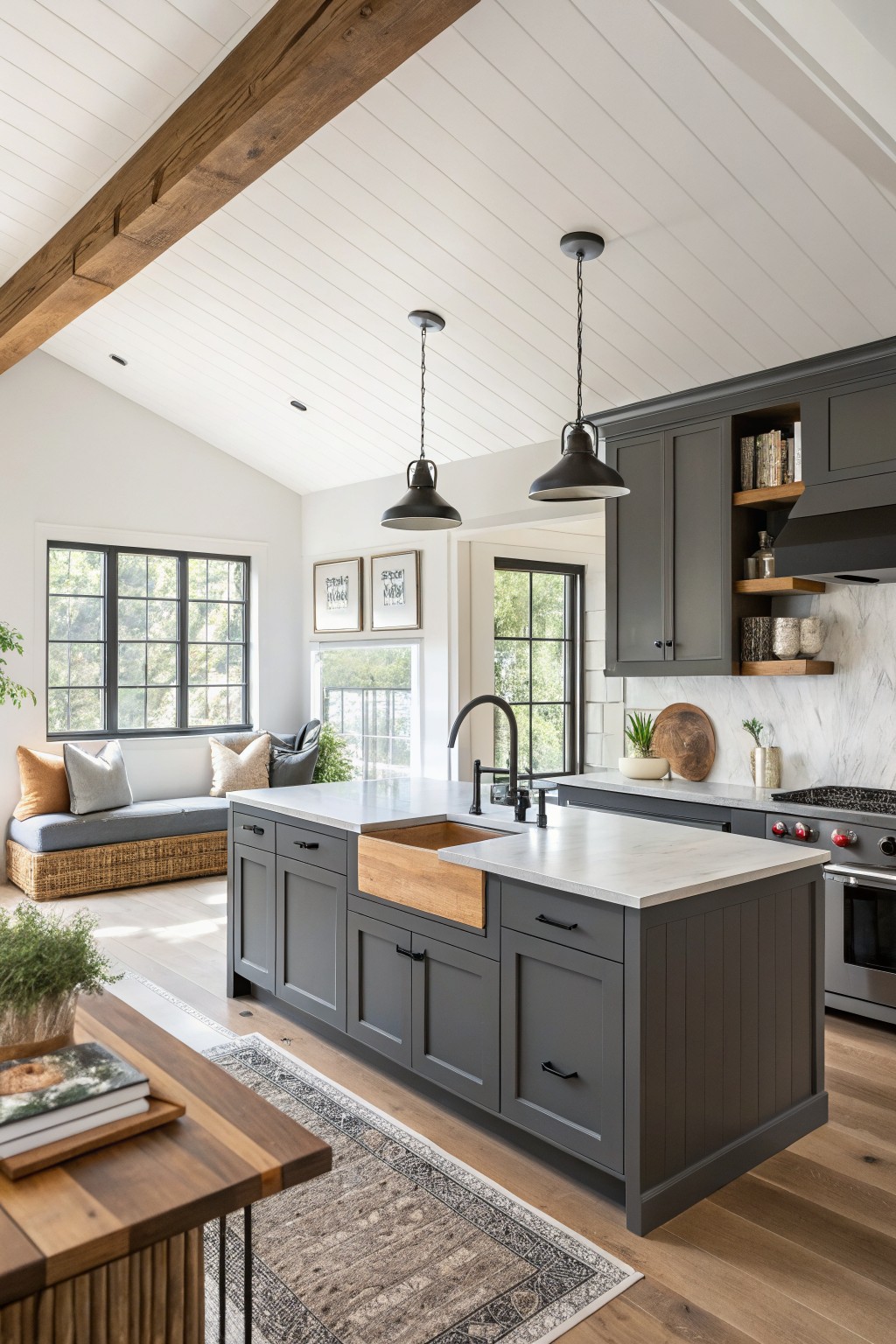Dark gray kitchen cabinets with a wood island and white counters.