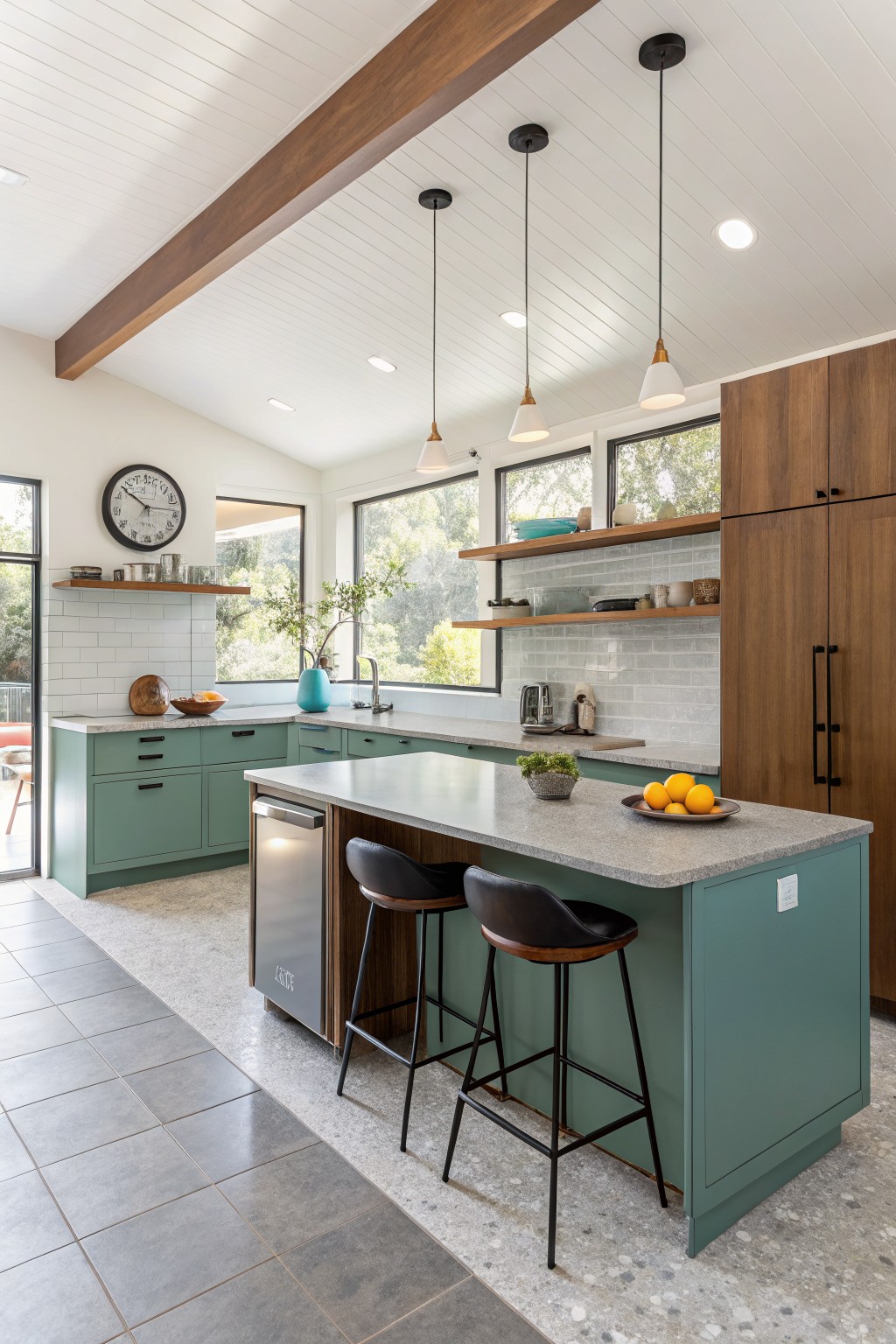 Modern kitchen with teal cabinets, central island, bar stools, and pendant lights