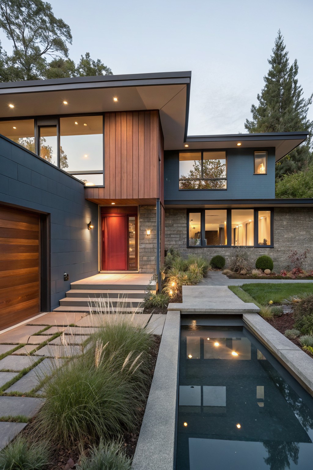 A split level house with muted blue gray siding and wood details.