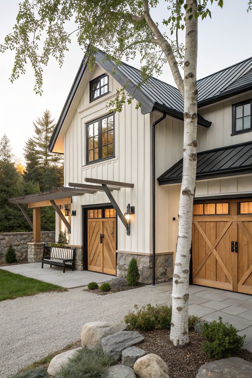 A modern house with warm white vertical siding, black trim, and wood garage doors.