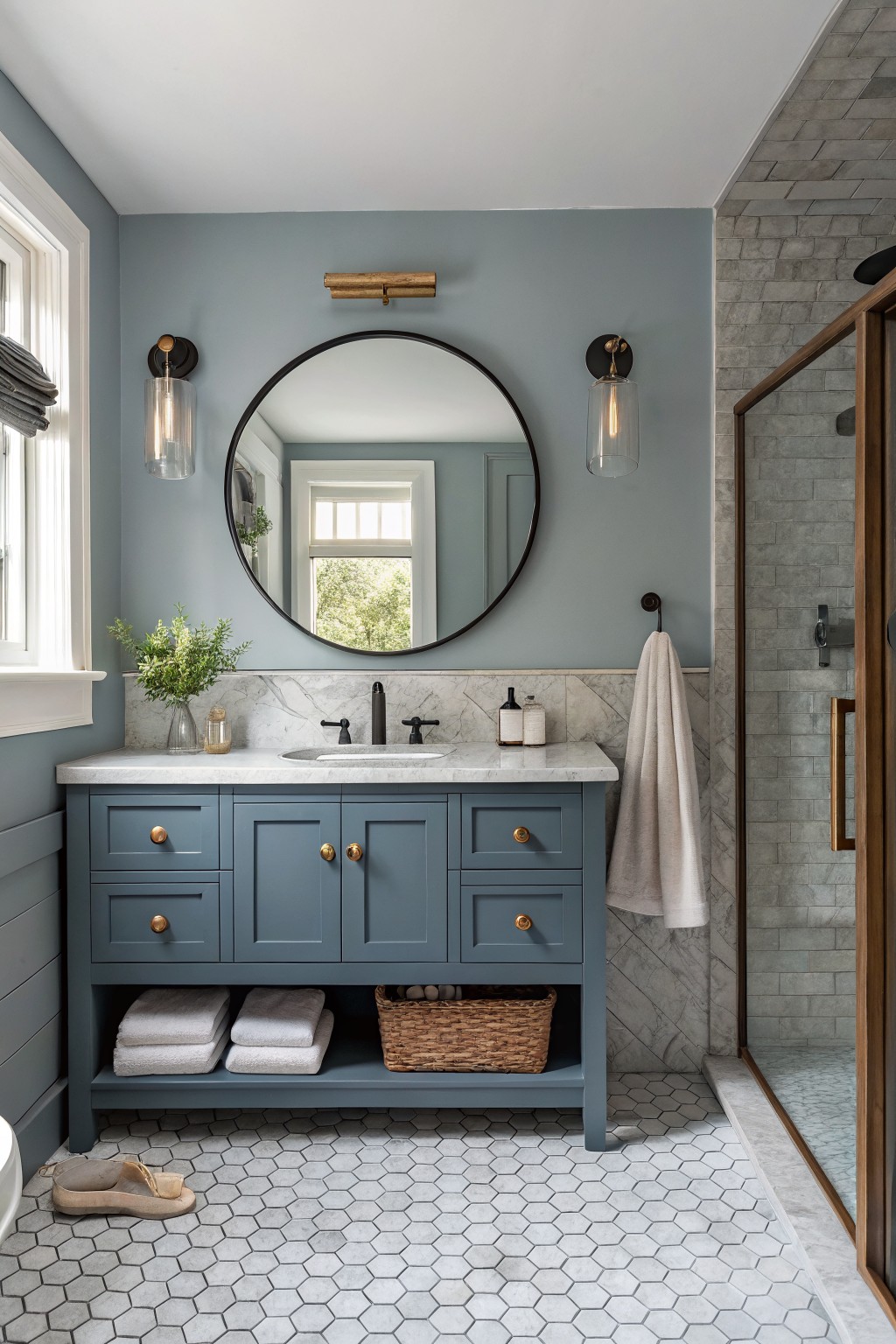 A bathroom featuring soft blue gray walls and a matching painted vanity.