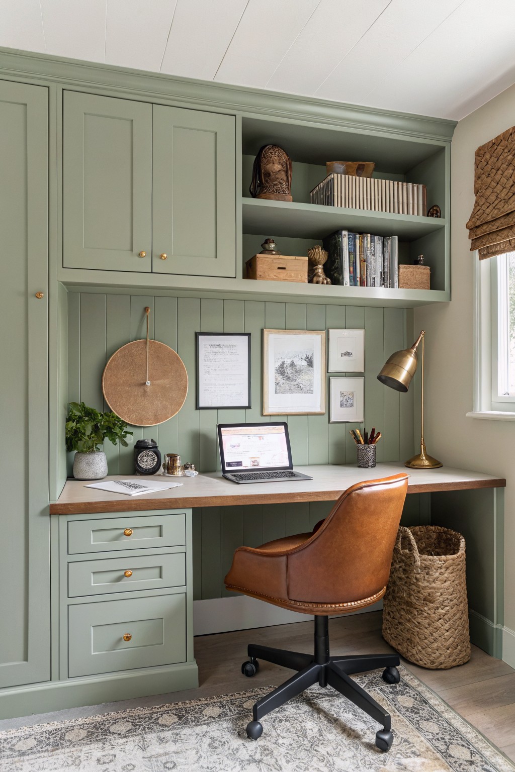 Built-in desk and cabinetry painted in a soft sage green.
