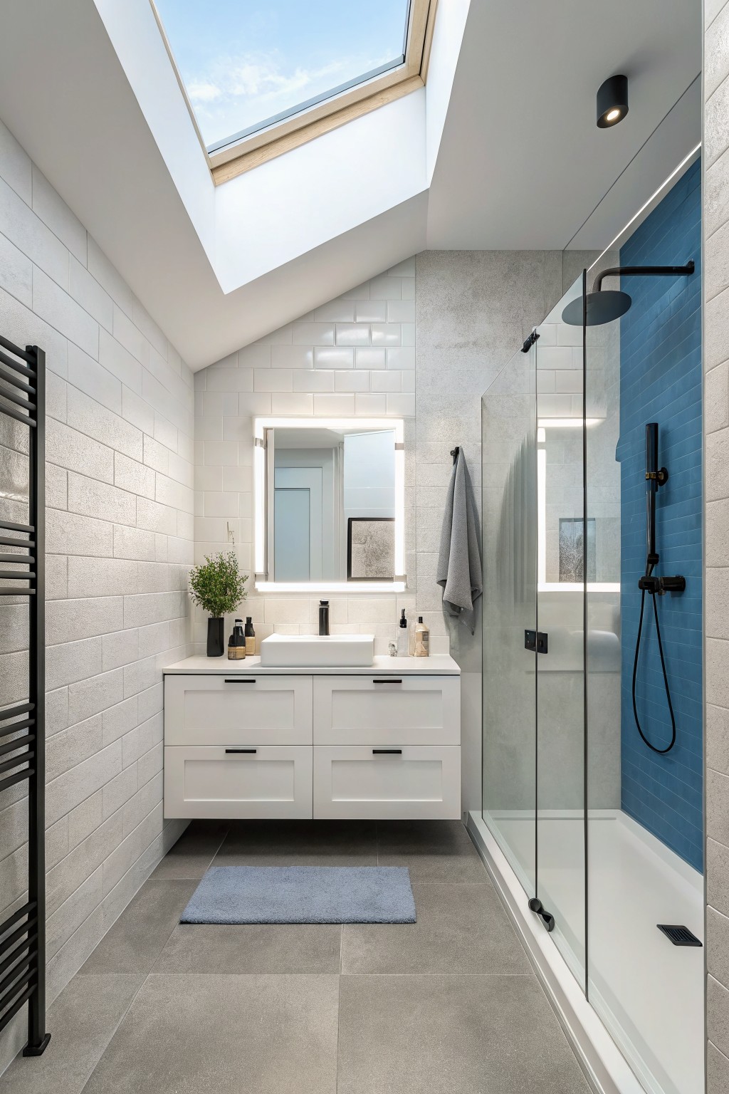 A bathroom with crisp white painted walls and ceiling above white subway tile.