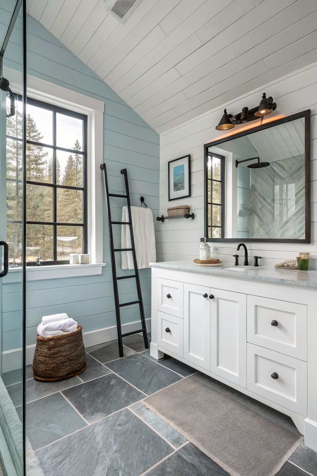 Bathroom walls painted in a soft blue with white vanity and dark accents.