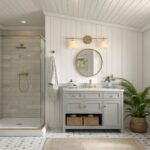 A bathroom featuring white shiplap walls and a light gray painted vanity.