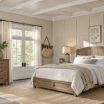 Bedroom walls painted in a soft warm greige with wood furniture and neutral bedding.