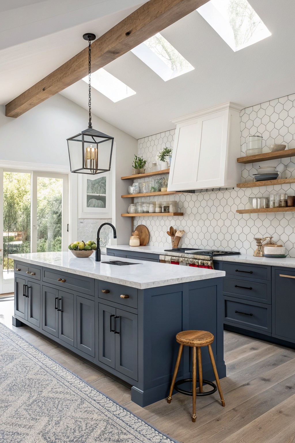 Navy blue cabinets in a kitchen with white counters and open wood shelves.
