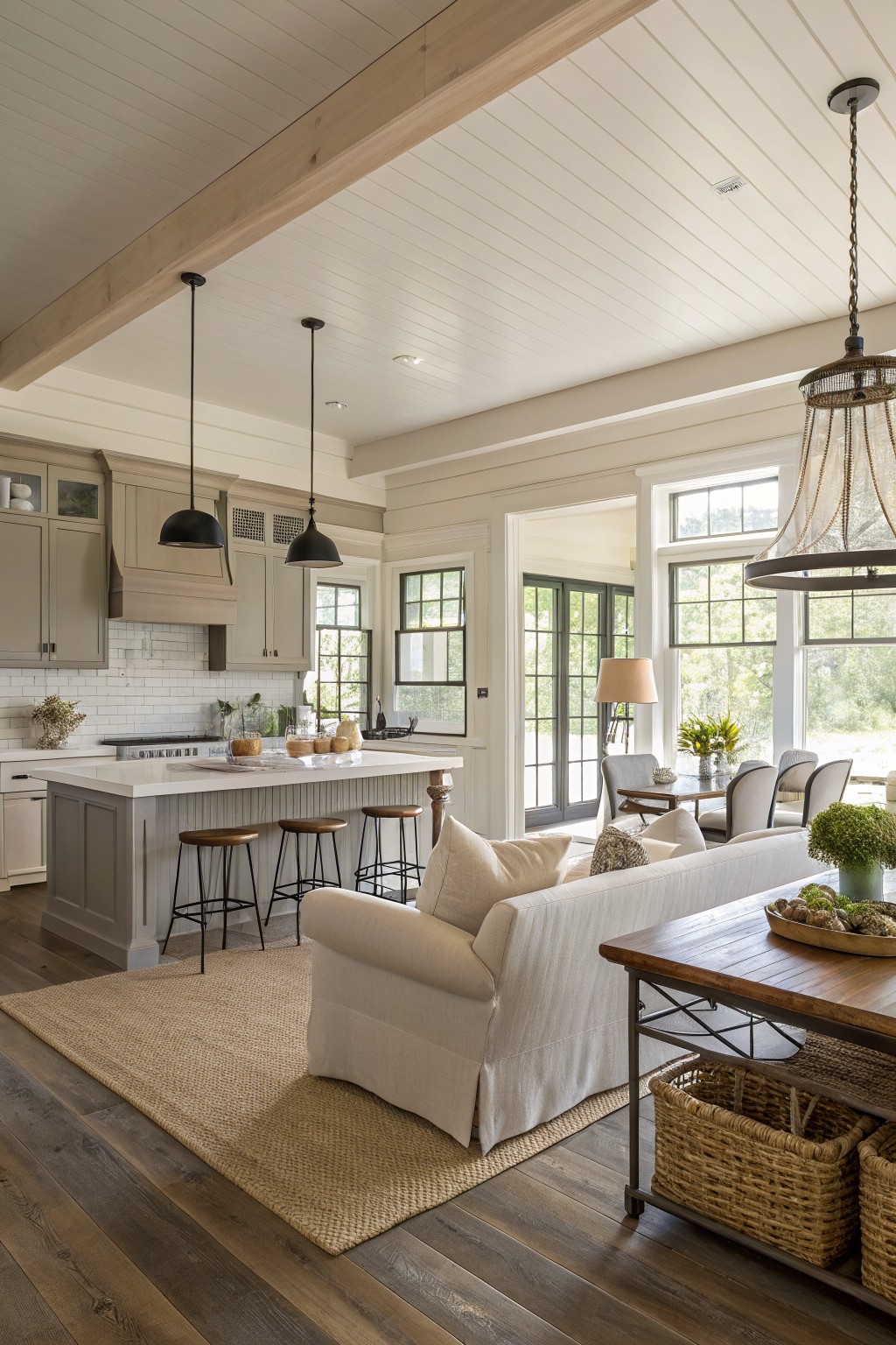 Kitchen and living area with soft greige walls and matching cabinetry.