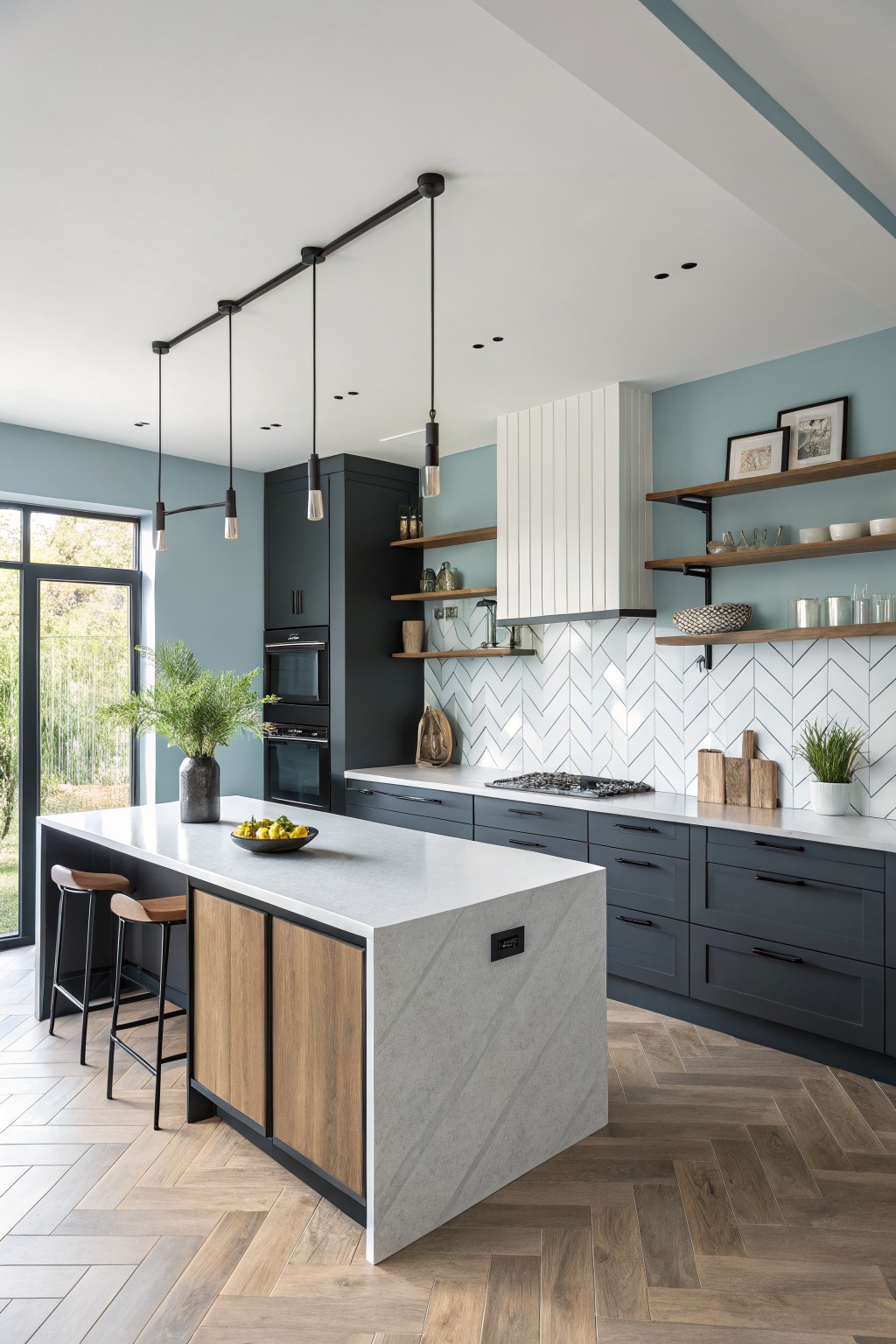 Light blue gray walls in a modern kitchen with dark cabinets and a white island.