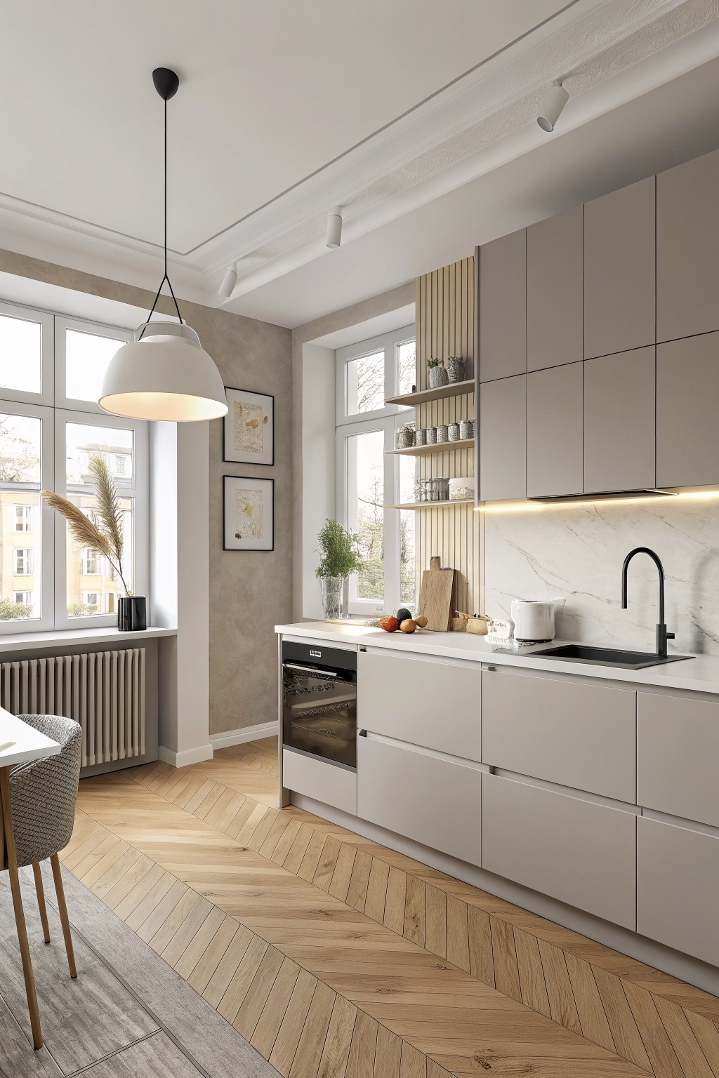 Kitchen with soft gray cabinets and herringbone wood flooring.