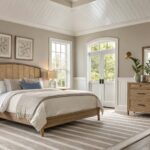 A bedroom with soft greige walls and wood furniture.