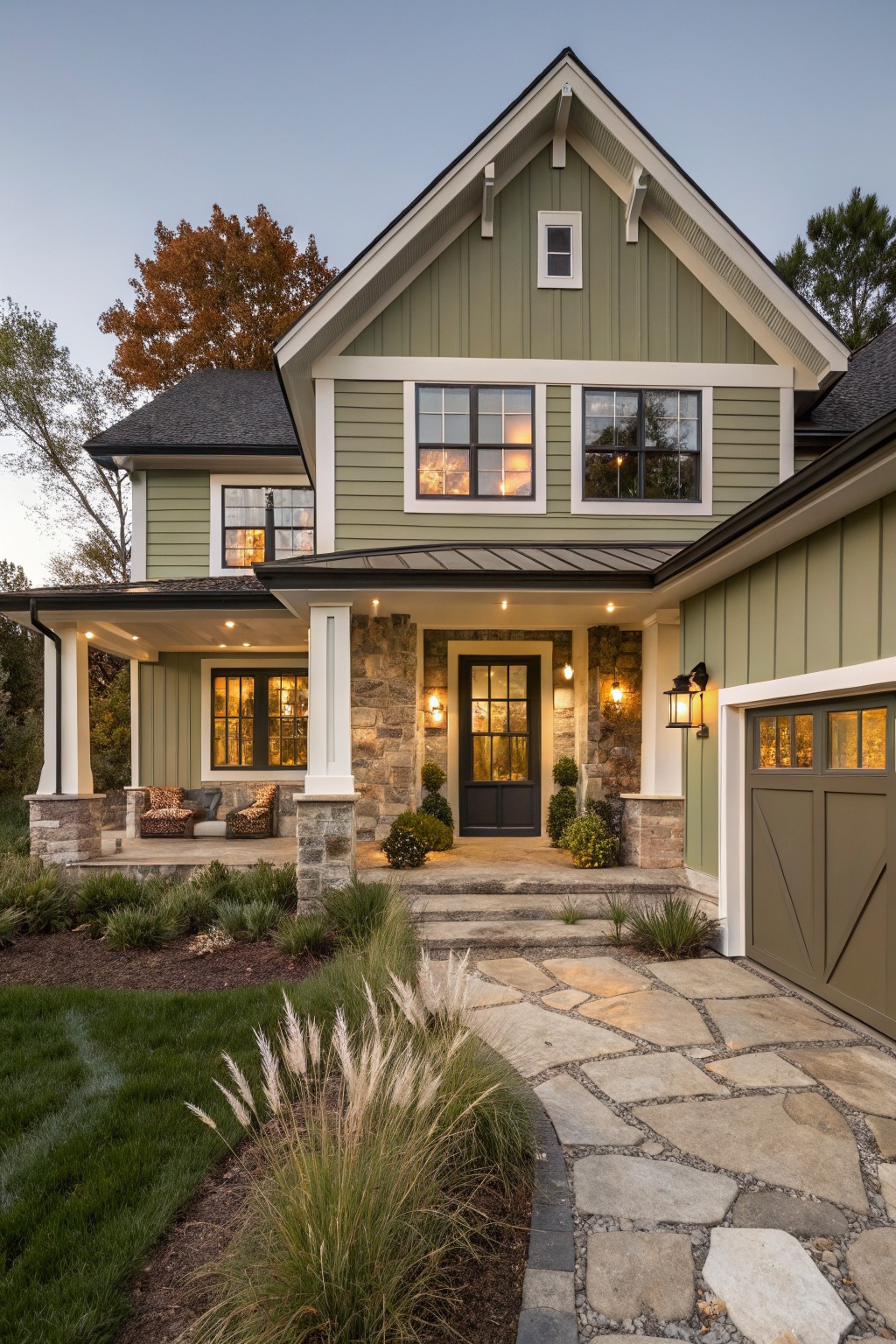 A house exterior painted in soft sage green siding with white trim.