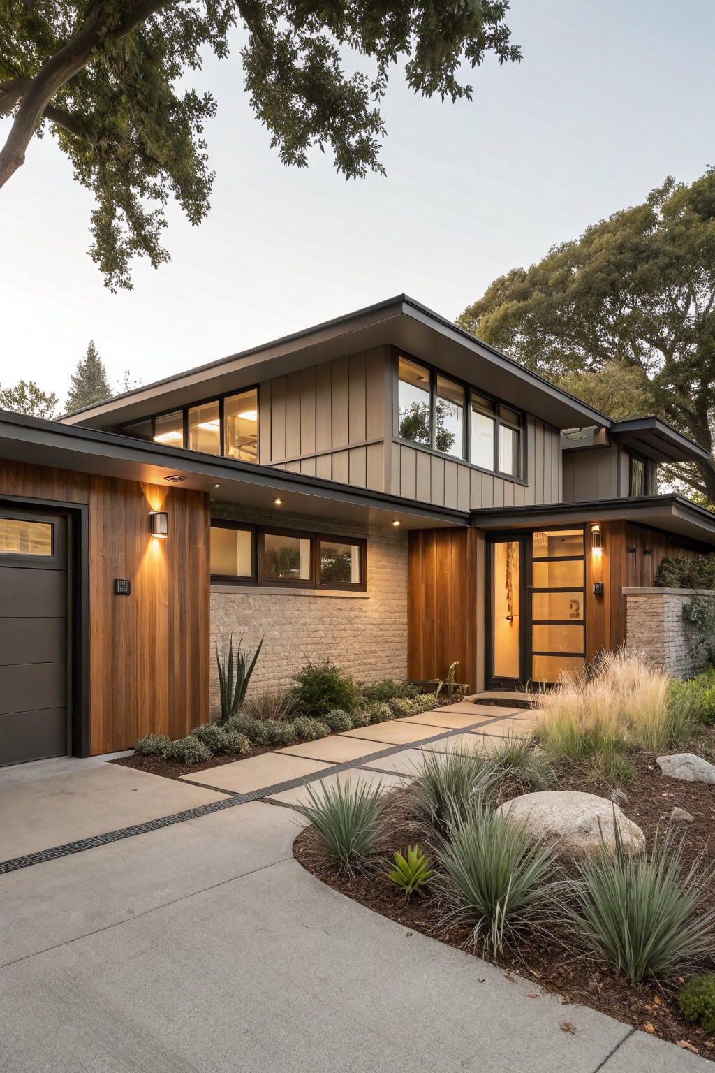 Modern house exterior with warm greige siding and wood accents.