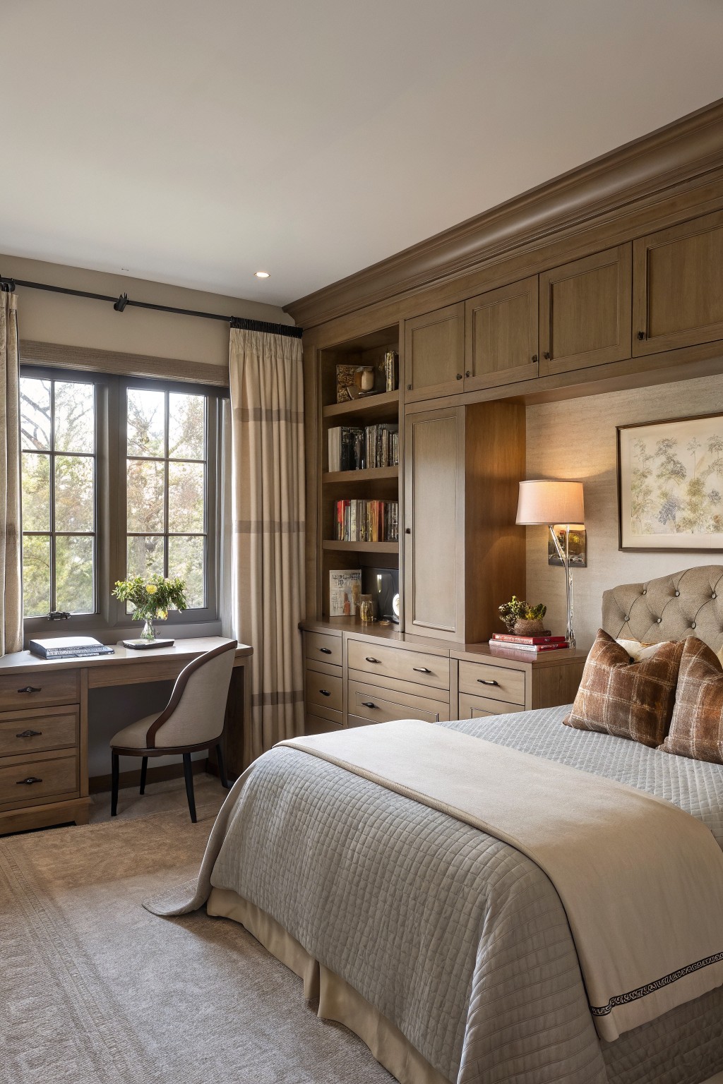 Warm greige walls in a bedroom with wood built-in cabinetry.