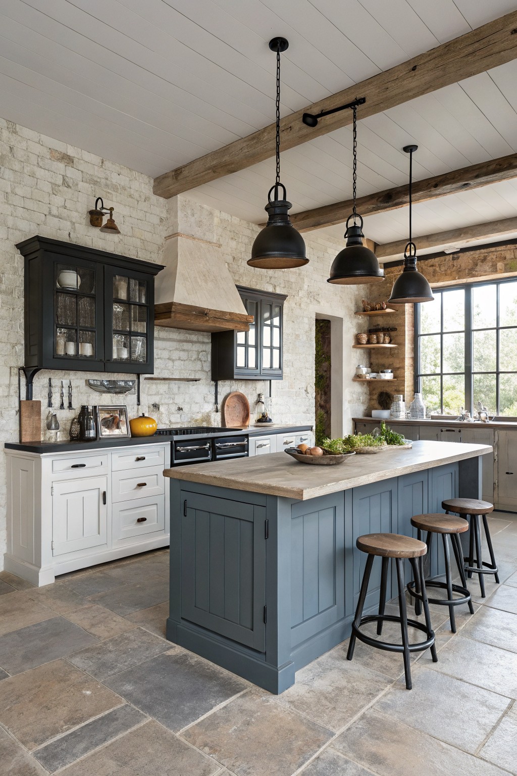 A kitchen island painted in a muted blue gray with white cabinets along the back wall.