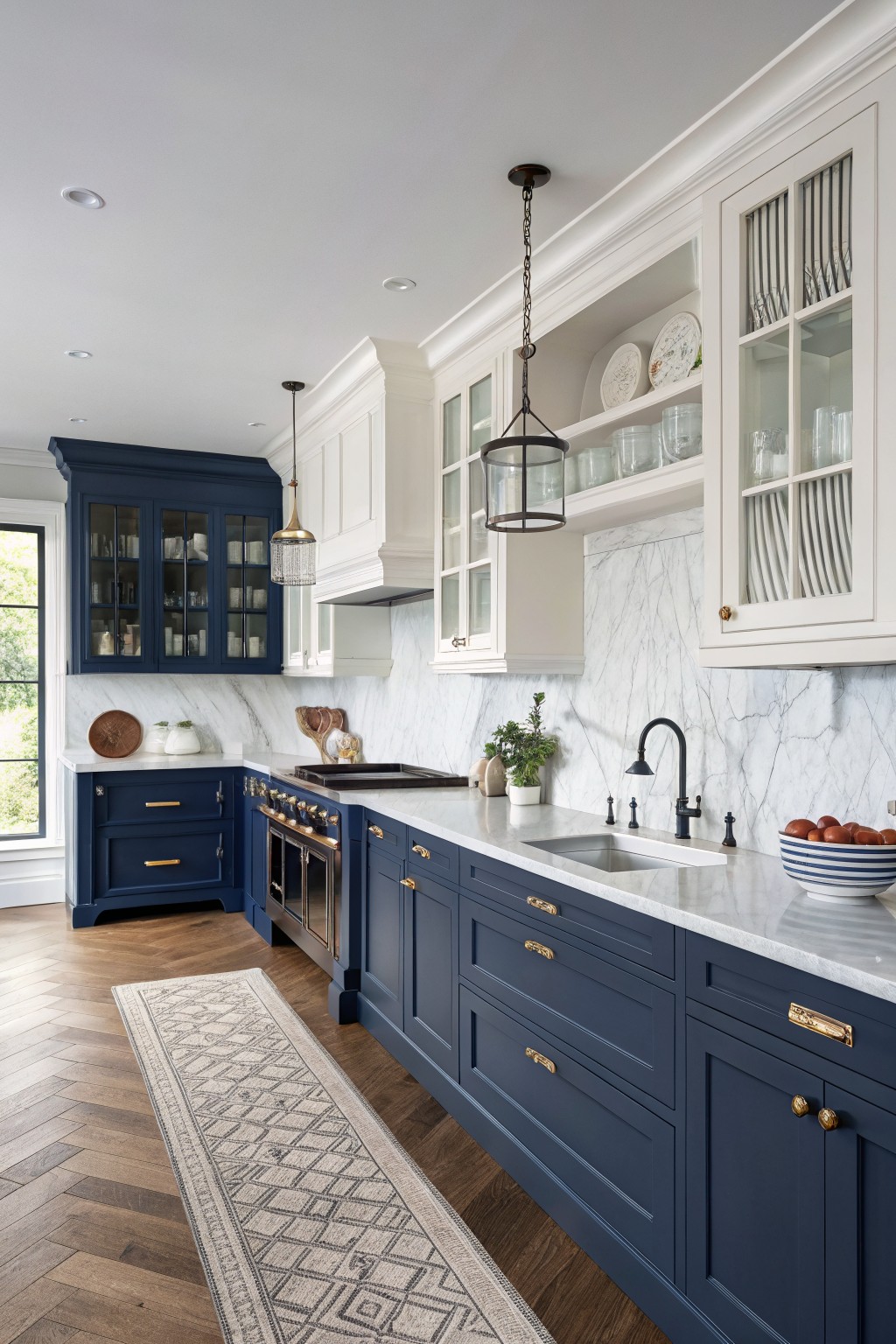 Navy blue lower cabinets paired with white upper cabinets in a kitchen.