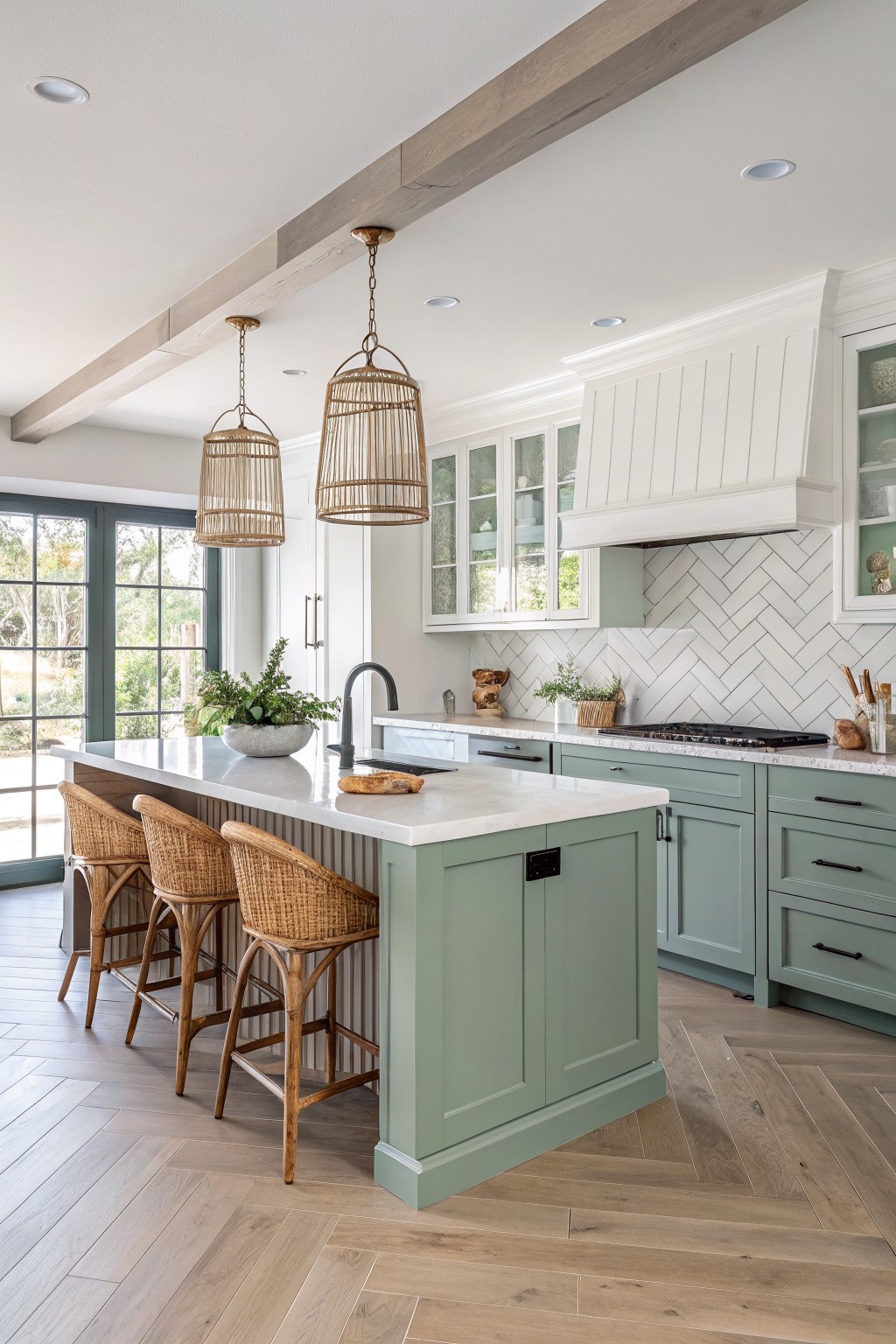 Kitchen with soft sage green lower cabinets paired with white upper cabinets.