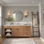 Bathroom walls painted in a soft greige color above white wainscoting.