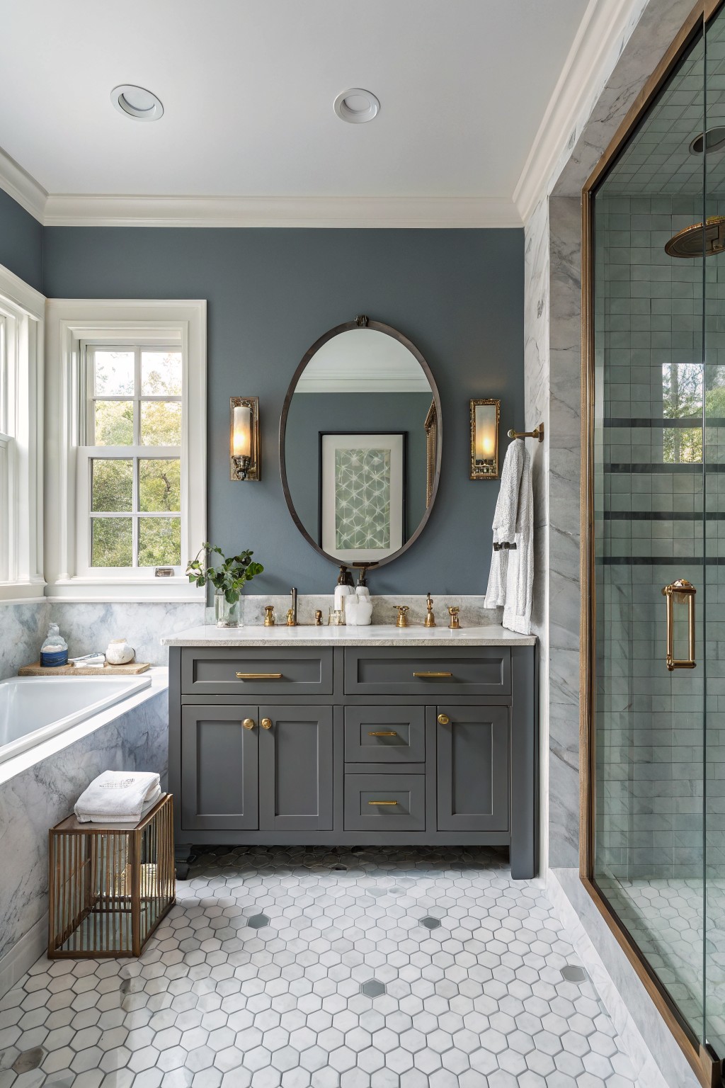 A bathroom with soft blue gray walls and a gray vanity.