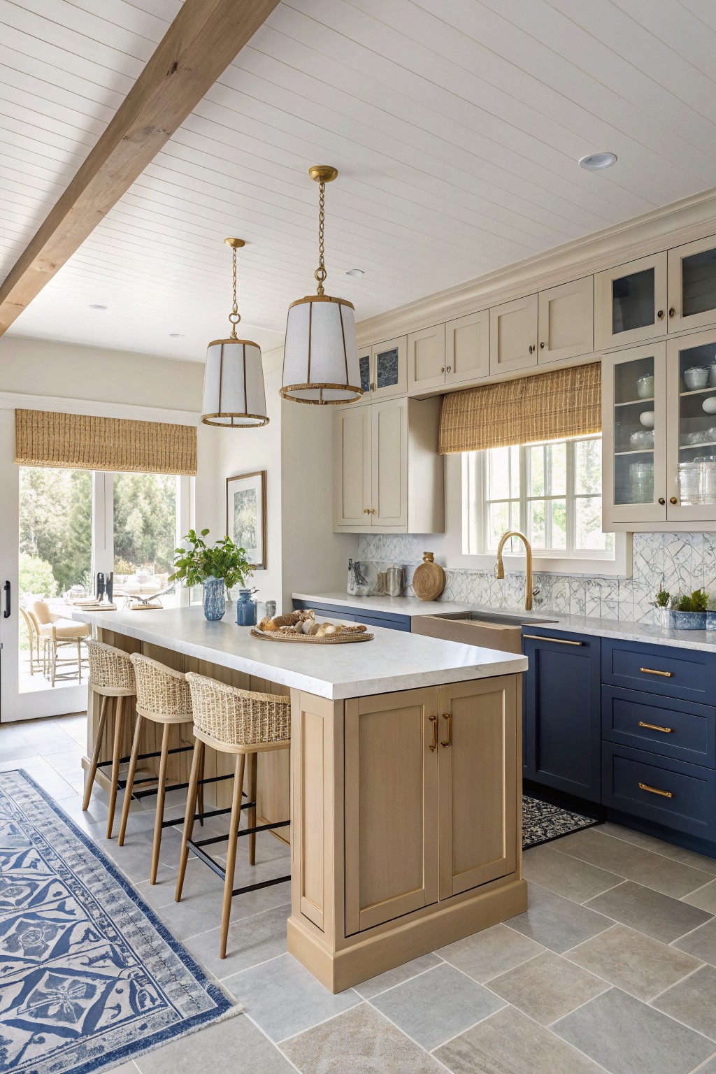Kitchen showing warm cream painted upper cabinets paired with navy base cabinets.