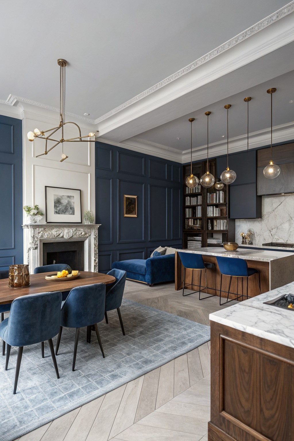 Navy blue walls and velvet seating in elegant open kitchen and dining area
