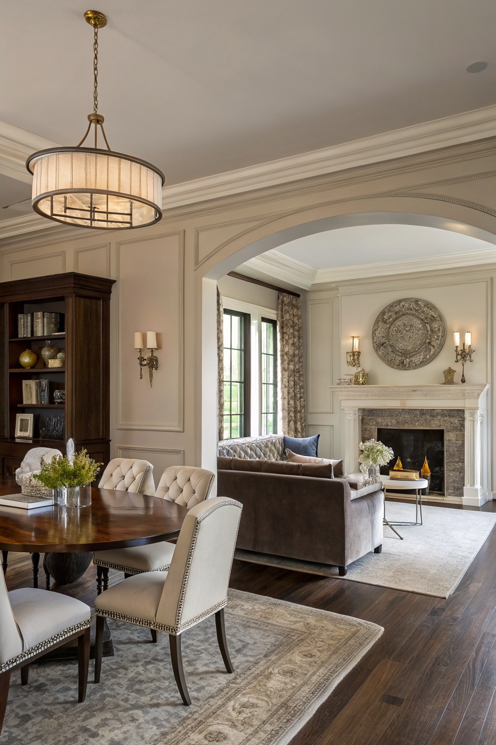 Open dining and living area with warm greige walls.
